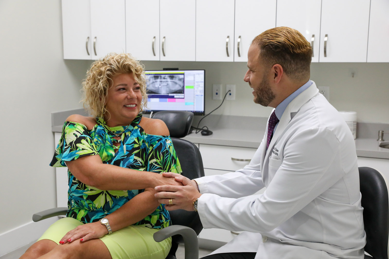 Dr Planes Discussing Options with Dental Implants Patient
